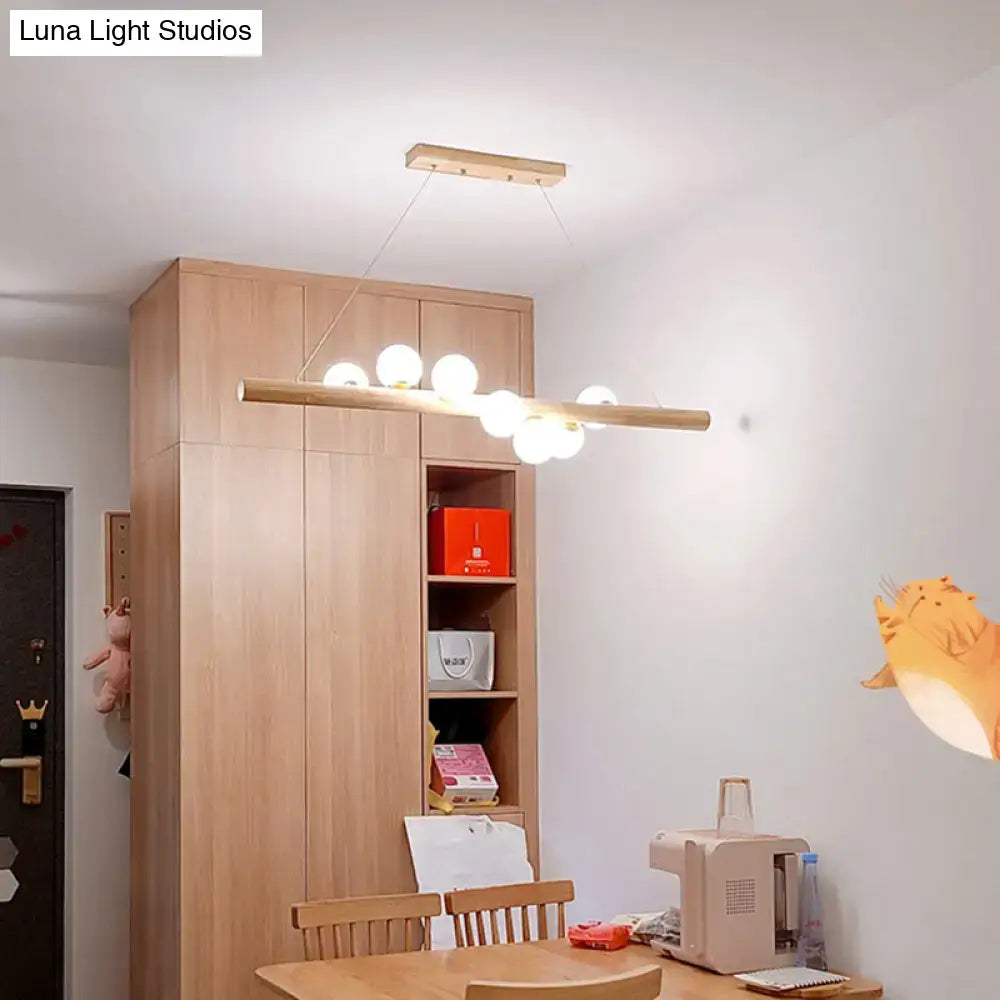 Decorbites™ minimalist cream glass led pendant light with wooden bar and white spherical bulbs for restaurants ball island pendant
