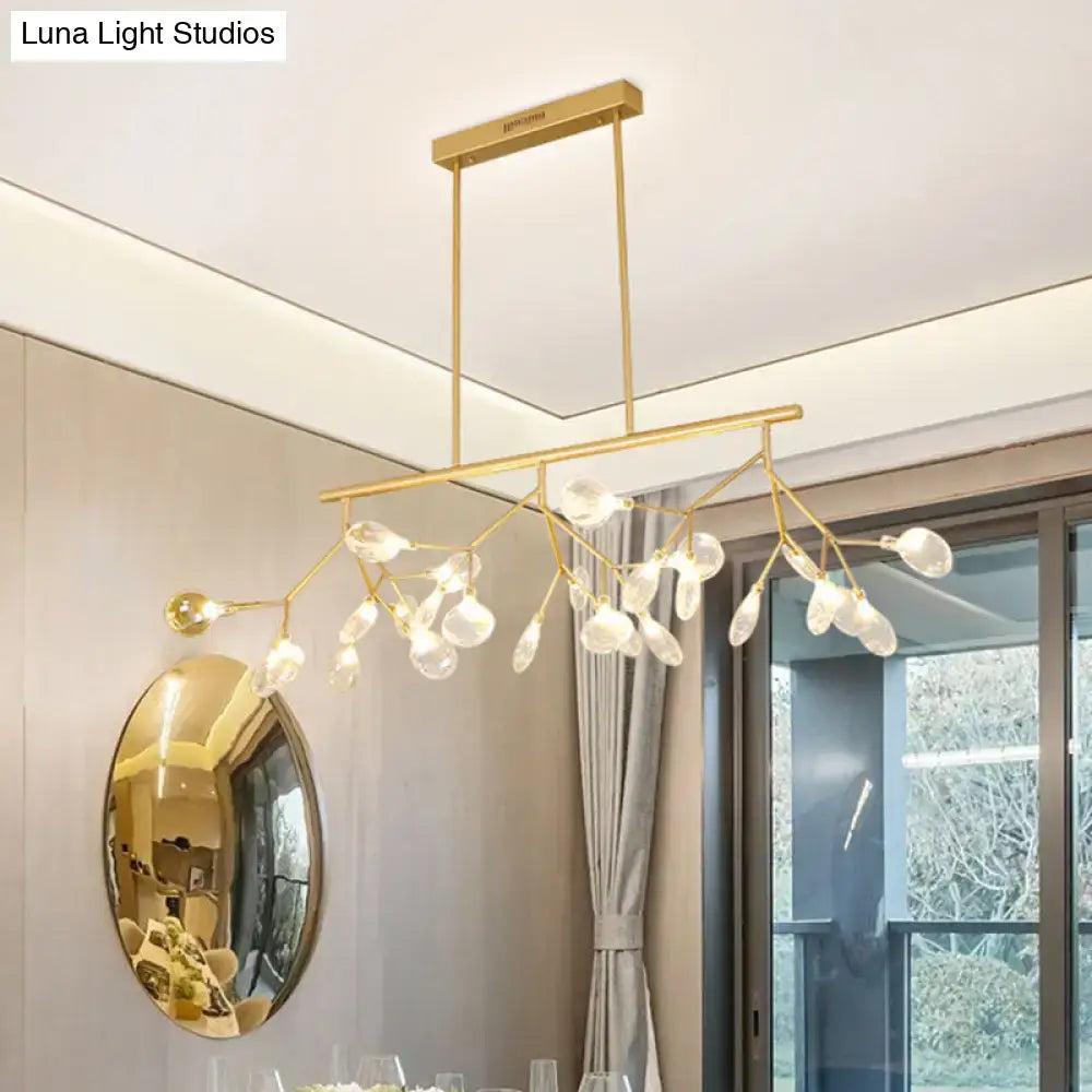 Gold-toned DecorBites minimalist firefly island glass lamp with bulb base and white clear teardrop pendants for dining room