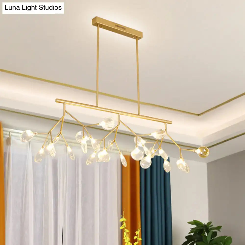 Gold-toned DecorBites™ minimalist firefly island glass lamp with white clear teardrop glass pendant bulbs for dining room