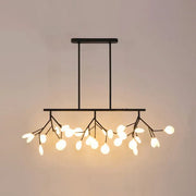 Black metal chandelier with delicate branch-like arms holding white clear glass lamp bulbs for dining room lighting
