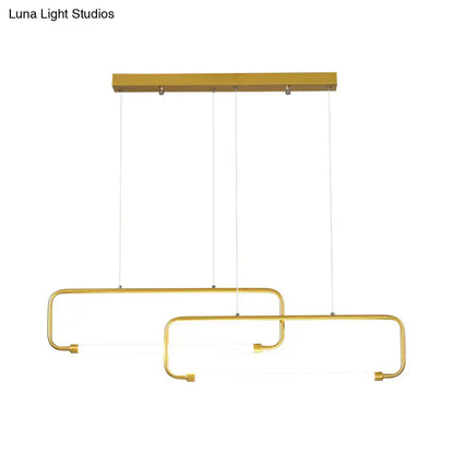 Gold-finished DecorBites™ minimalist geometric LED dining room pendant light with overlapping rectangular frames and black gold color remote