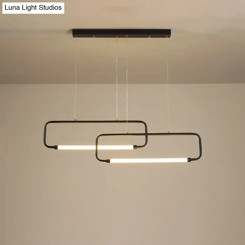 Modern black metal rectangular pendant light with two overlapping illuminated bars for dining room with color remote