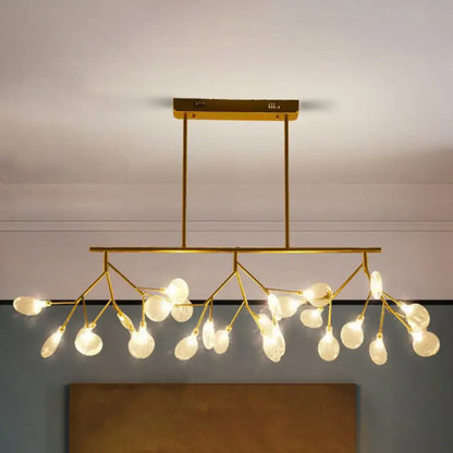 Gold-toned modern ceiling light fixture with acrylic frosted glass globes perfect for dining room fixture width display