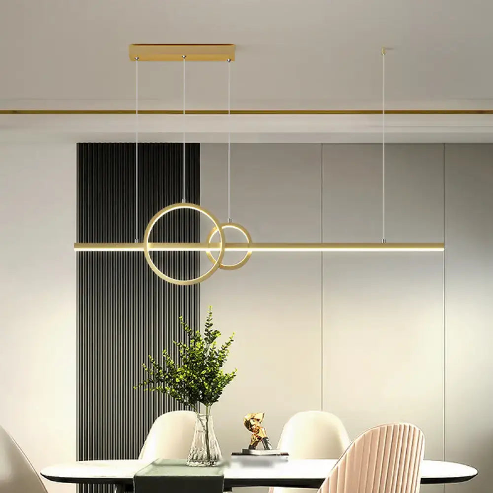 DecorBites™ minimalist LED ceiling light in gold tone with linear intersecting rings and warm third gear for kitchen island