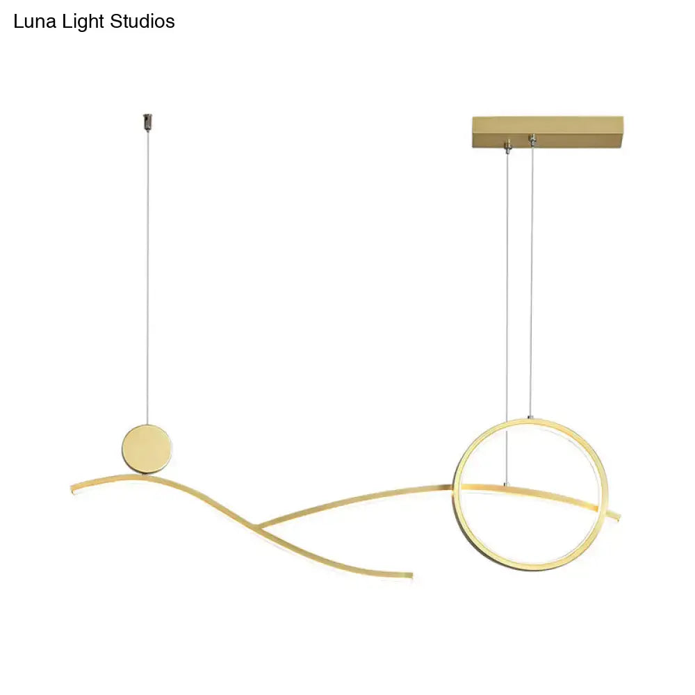 Modern gold-toned minimalist metal LED hanging light with curved geometric elements for dining room and kitchen island