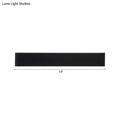 Black rectangular table runner 19 inches long displayed with minimalist black and silver wall lamp for living room warm white light