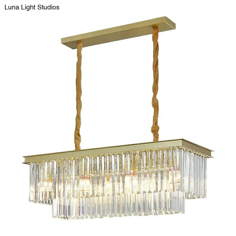 Gold-finished minimalist prismatic crystal pendant light with cascading clear prisms and twisted rope suspension cords