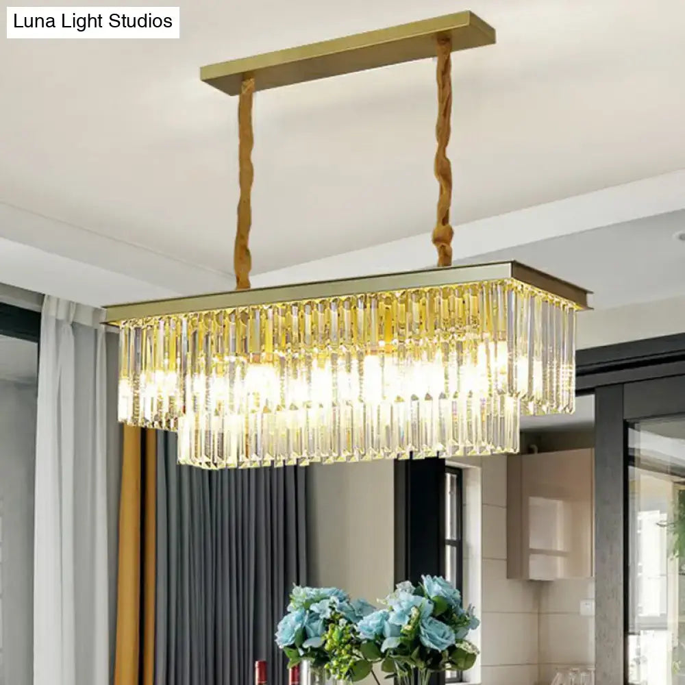 Gold-toned minimalist prismatic crystal pendant light with rectangular shape and cascading clear crystal prisms for restaurants