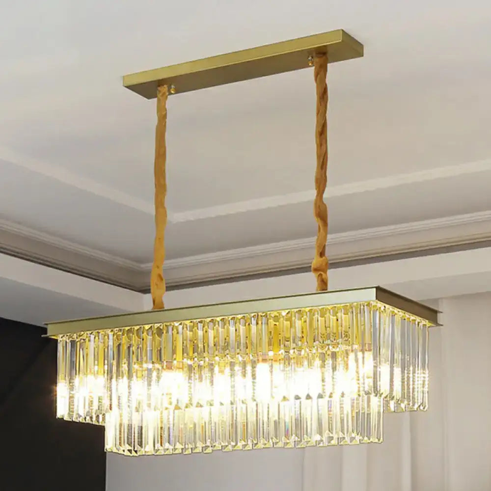Gold-toned rectangular minimalist prismatic crystal pendant light with cascading clear crystal prisms for restaurant use