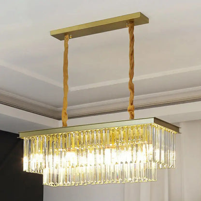Gold-toned rectangular minimalist prismatic crystal pendant light with cascading clear crystal prisms for restaurant use
