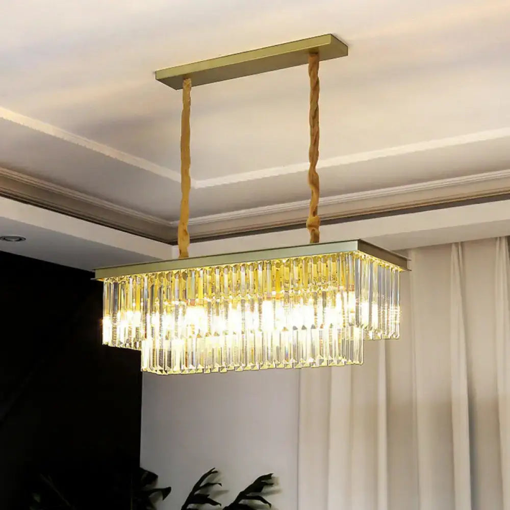 Gold-toned rectangular pendant light with minimalist prismatic crystal prisms and twisted rope suspension for restaurants