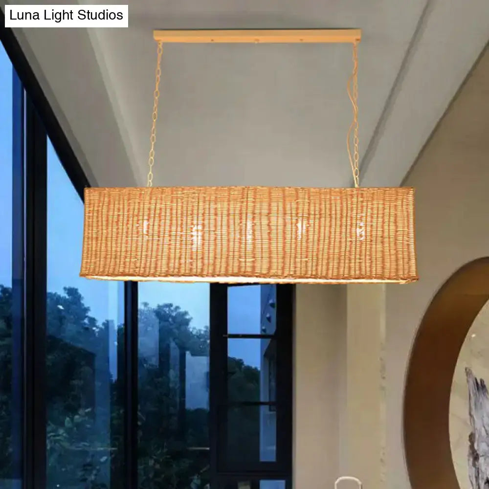 Decorbites minimalist rectangular woven rattan restaurant hanging lamp with natural tan finish and gold chain suspension