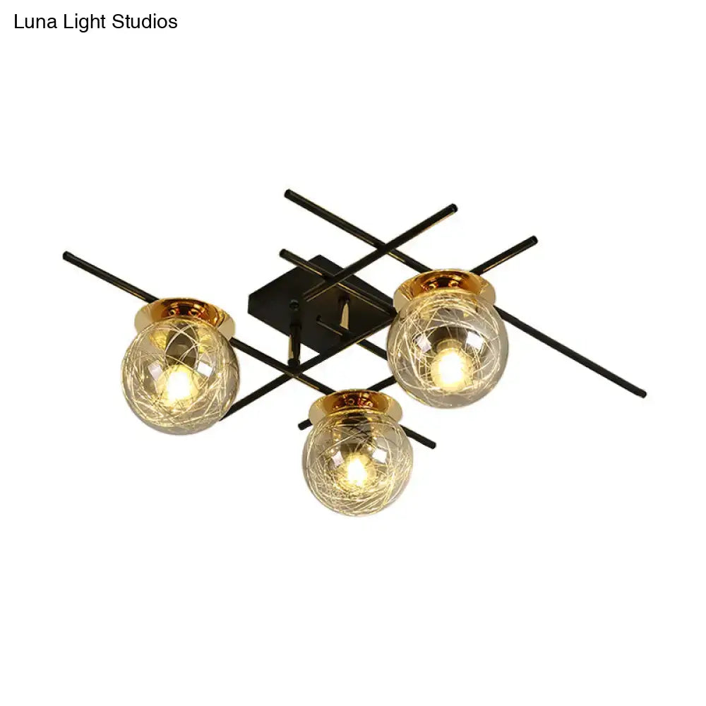 Modern black metal 3-head semi-flush ceiling light with clear smoke gray glass and gold-toned rims for bedroom use