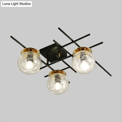 Black metal DecorBites™ ceiling light with three crackled glass globe shades in clear smoke gray and gold rims for bedroom use