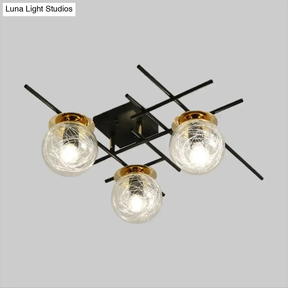 Modern black metal semi-flush ceiling light with three clear smoke gray crackled glass globes and gold-toned rims for bedroom
