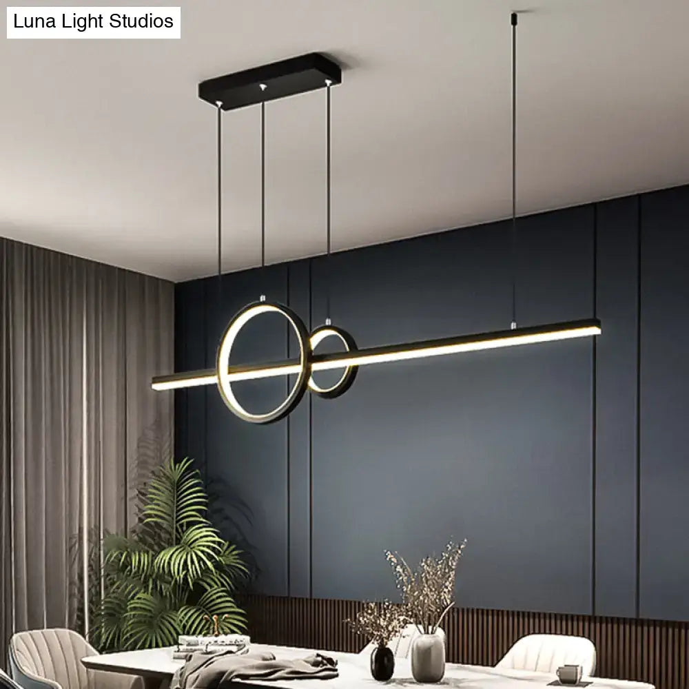 Modern black and gold minimalist acrylic ceiling light with intersecting circular rings for dining room decor