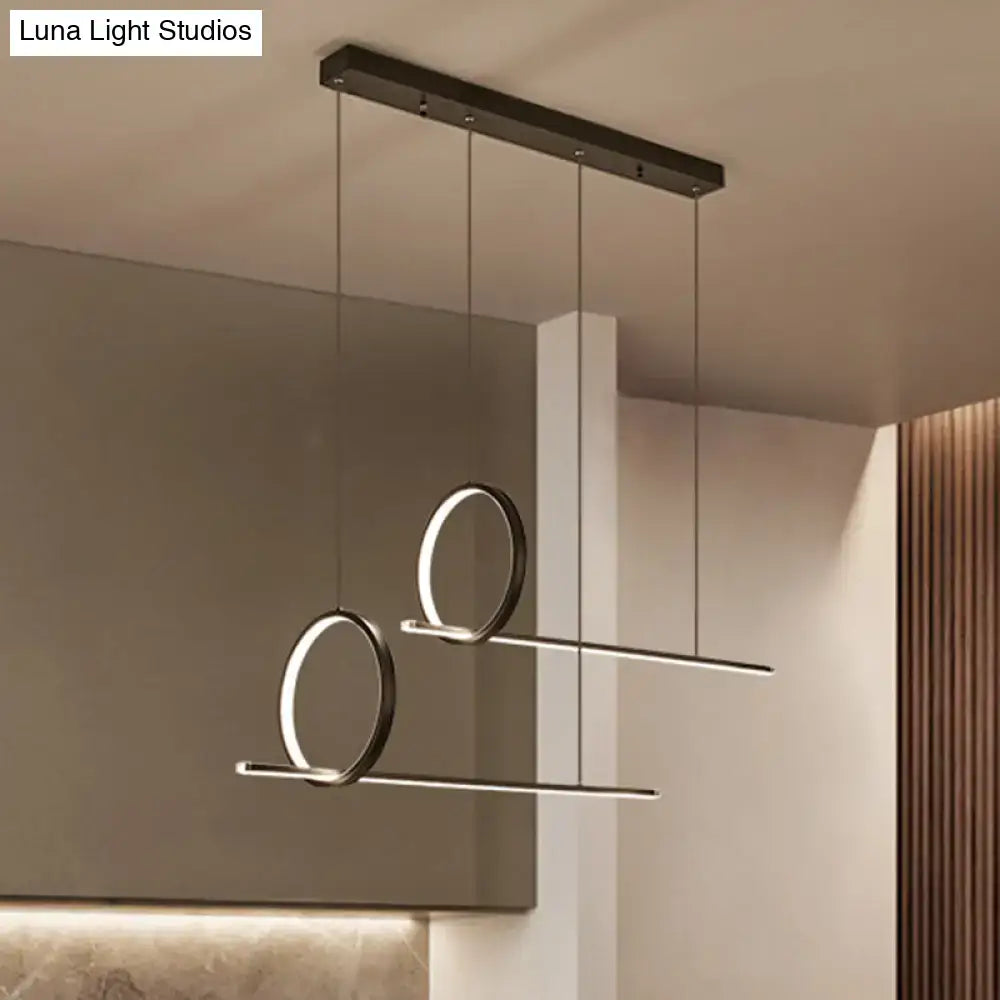 Black minimalistic iron pendant light fixture with two glowing circular rings for modern ceiling light decor