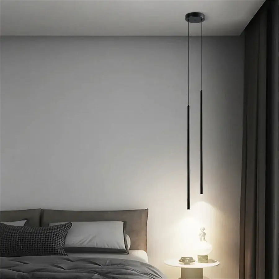 Modern black minimalist 2cm led pendant lights with sleek cylindrical rods and circular ceiling mount for kitchen island