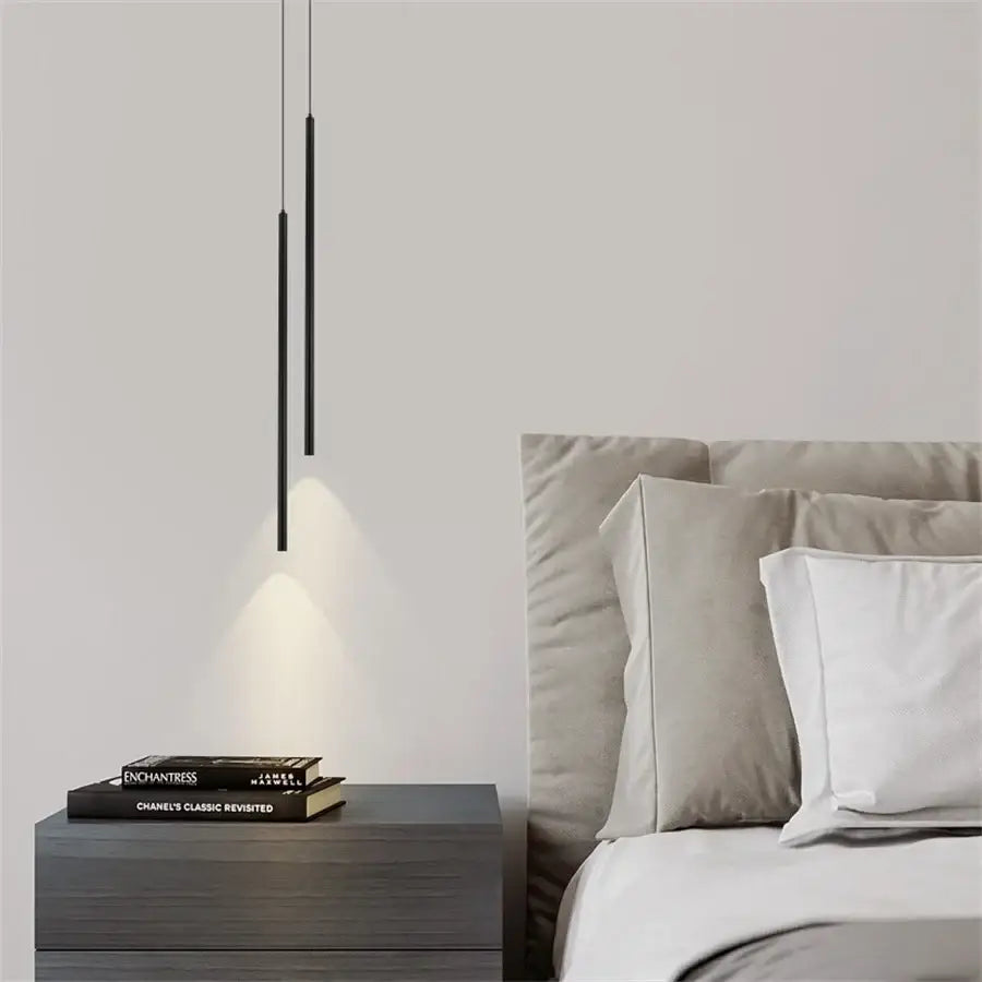 Decorbites™ modern black cylindrical 2cm led pendant light with sleek design hanging above kitchen island nightstand