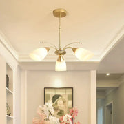 Decorbites modern gold-toned three-arm ceiling light with frosted white glass shade for elegant lighting