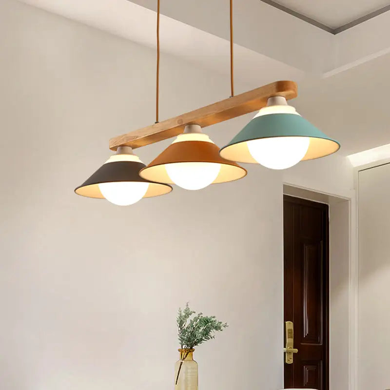 Modern three-light pendant lamp by decorbites with wooden beam and e26 bulb base in blue grey and yellow tones