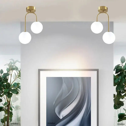 Gold-toned DecorBites™ modern acrylic ball ceiling light with two white spherical globes for home use