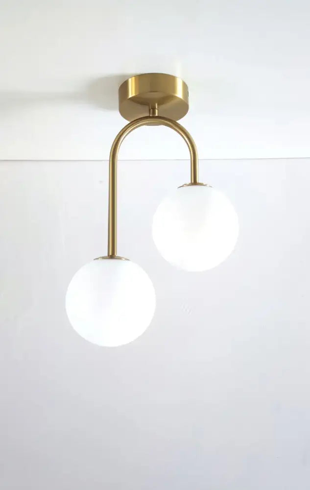 Decorbites modern gold-toned acrylic ball ceiling light with two frosted glass globe shades for home use