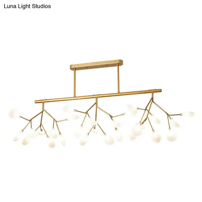 Gold-toned modern firefly island pendant with branching metal arms and frosted glass globe shades for dining room