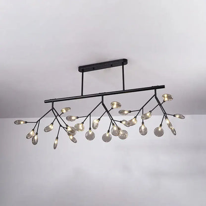 Black metal firefly island pendant chandelier with branching arms and clear glass globe bulbs for dining room lighting