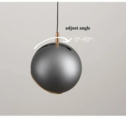 Matte black spherical decorbites™ modern adjustable led pendant light with brass accent and adjustable hanging mechanism