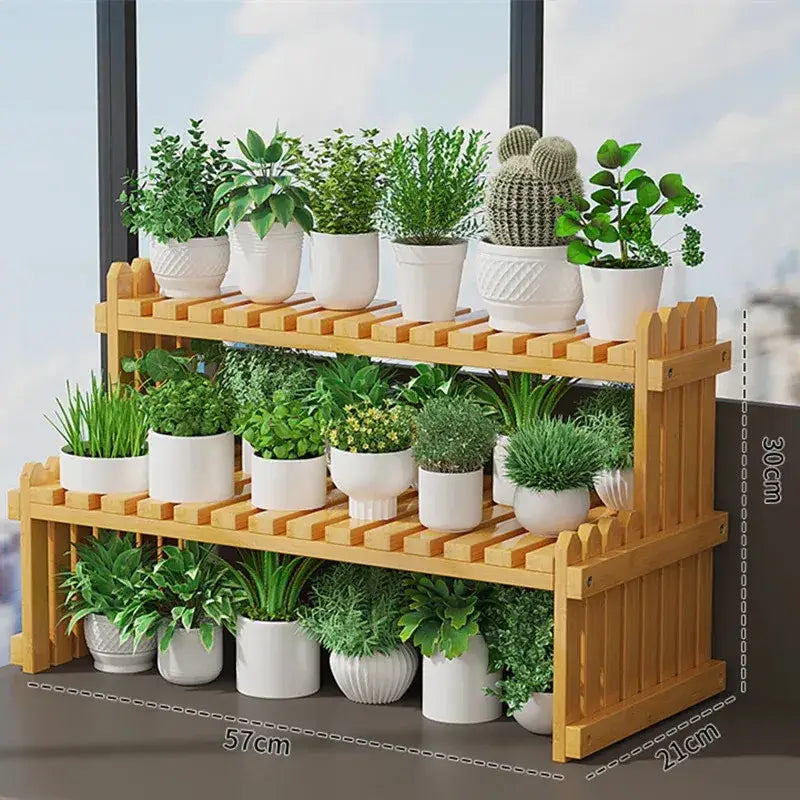 Light brown bamboo decorbites™ modern two-tier plant display stand with picket fence design holding white ceramic pots