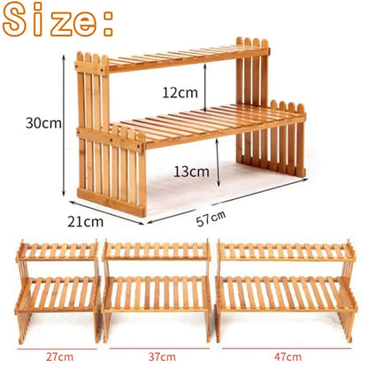 Light brown bamboo DecorBites modern 2-tier plant display stand with fence-like design and slatted shelves for plant display