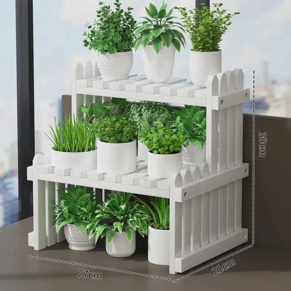 White picket fence-style modern bamboo 3-tier plant display stand with decorative vertical slats for plant display