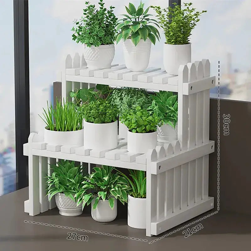 White picket fence-style modern bamboo 3-tier plant display stand with decorative vertical slats for plant display