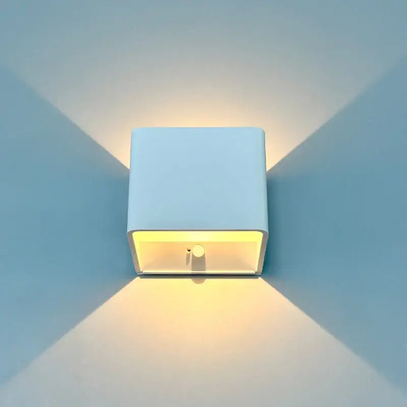 Decorbites™ modern battery operated white square wall sconce with warm yellow light from open front battery operated wall