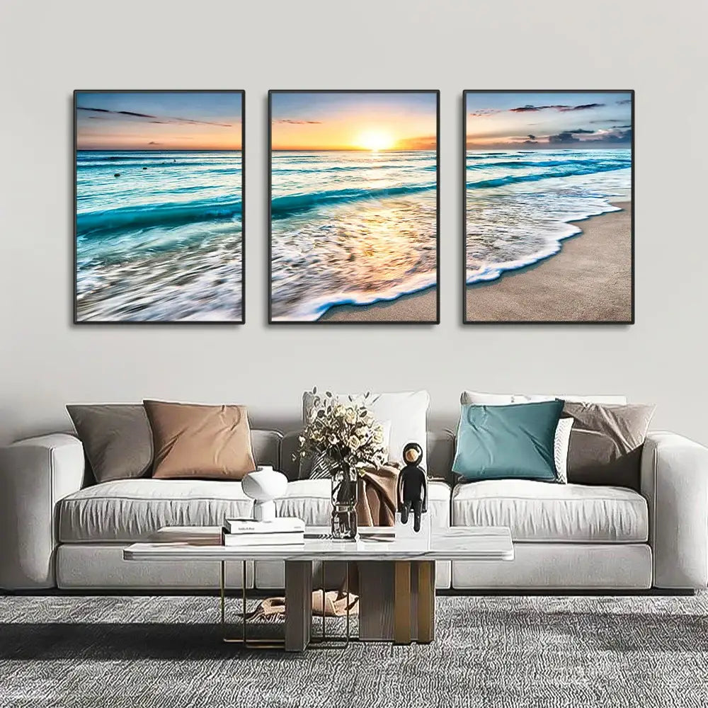 DecorBites modern three-panel beach sunset canvas wall art set with black frames featuring turquoise waves and golden sunset