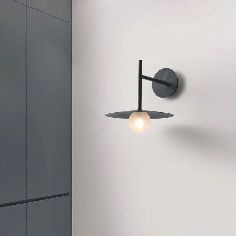 Decorbites™ modern bedside wall light black minimalist wall sconce with circular base slender arm and flat disc shade