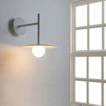 DecorBites modern bedside wall light with matte gray metal arm and warm globe bulb in minimalist wall light design