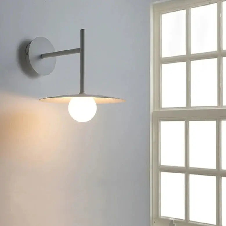 DecorBites modern bedside wall light with matte gray metal arm and warm globe bulb in minimalist wall light design