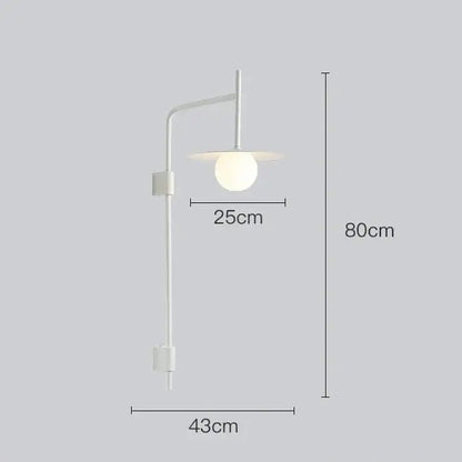 Minimalist white DecorBites™ modern bedside wall light with a sleek curved arm and spherical glass shade