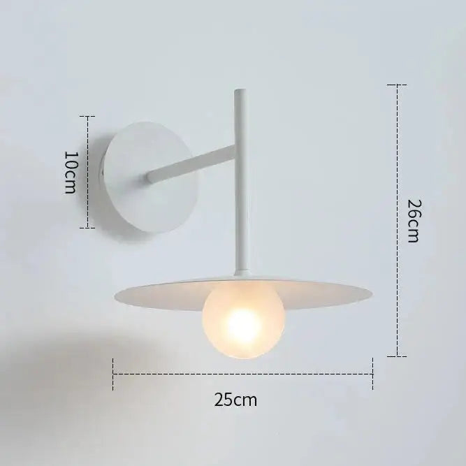 DecorBites™ modern bedside wall light in white features a minimalist design with a circular base and illuminated globe bulb