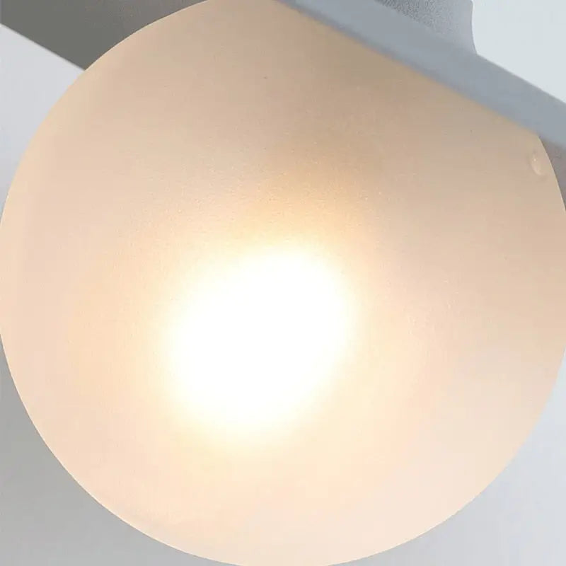 Decorbites modern bedside wall light with warm frosted glass globe and soft diffused glow as a bedside wall light