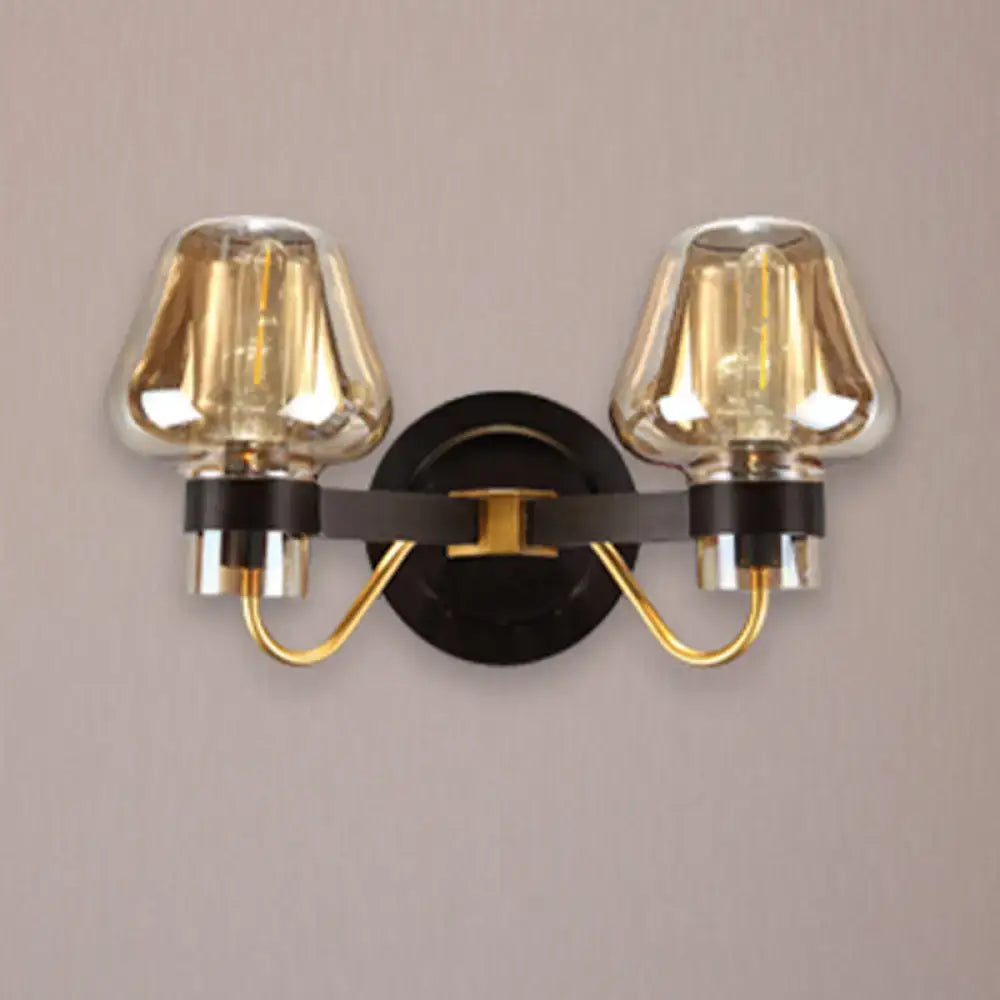 Modern black and gold two-light fixture with amber glass mushroom sconce light ideal for living room decor