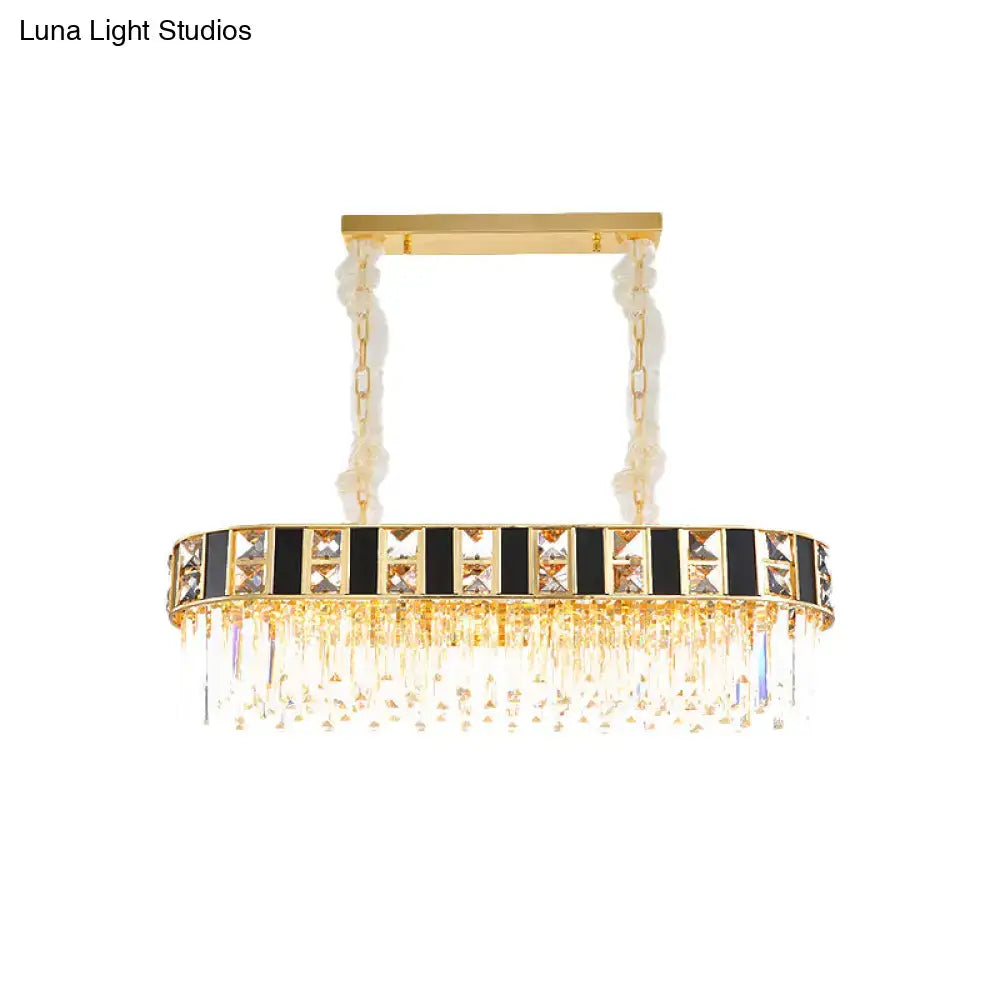 Gold-toned rectangular crystal oval island light with black and clear accents and 12 heads for dining room ceiling