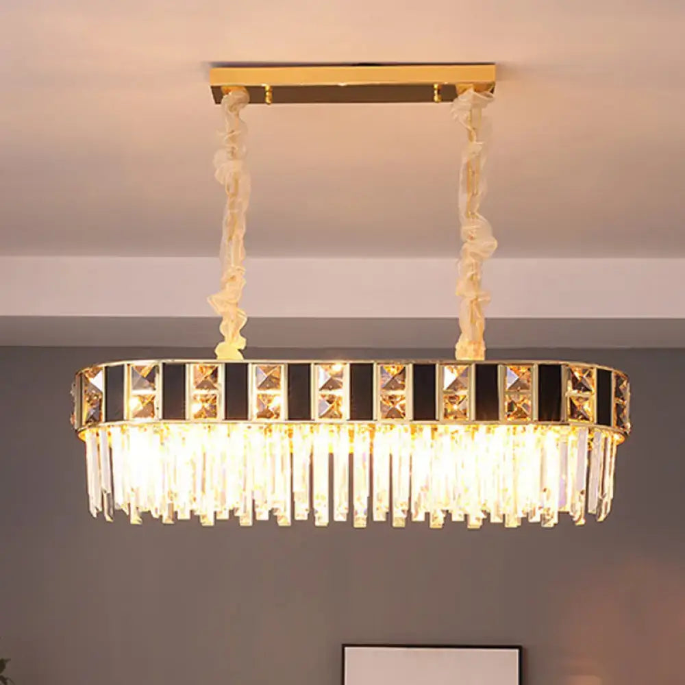 Gold-framed rectangular crystal oval island light with black and clear k9 crystals on twisted cream cords for dining room