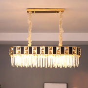 Gold-framed rectangular crystal oval island light with black and clear k9 crystals on twisted cream cords for dining room