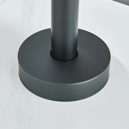 Matte black cylindrical table leg with circular base featured in DecorBites™ modern black floor mounted tub faucet design