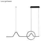 Black minimalist pendant ceiling light with wave-like wire design and circular accent providing warm white light