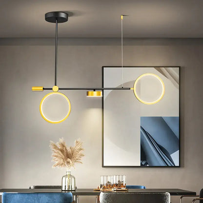 Modern black and gold metal pendant light with illuminated circular rings featuring warm white 220v-240v 110v-120v illumination