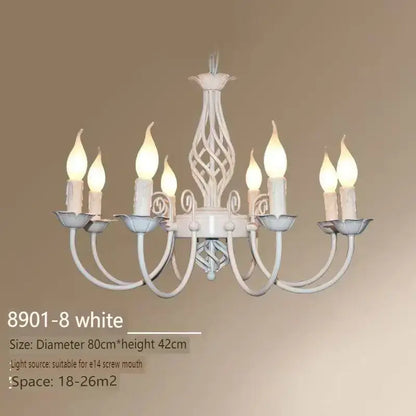 White wrought iron chandelier with eight candle-style bulbs and ornate twisted design for living room lighting
